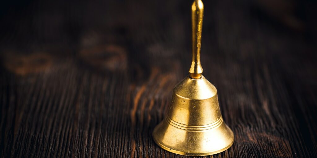 Antique brass hand bell