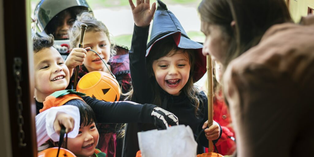 Little children trick or treating on Halloween
