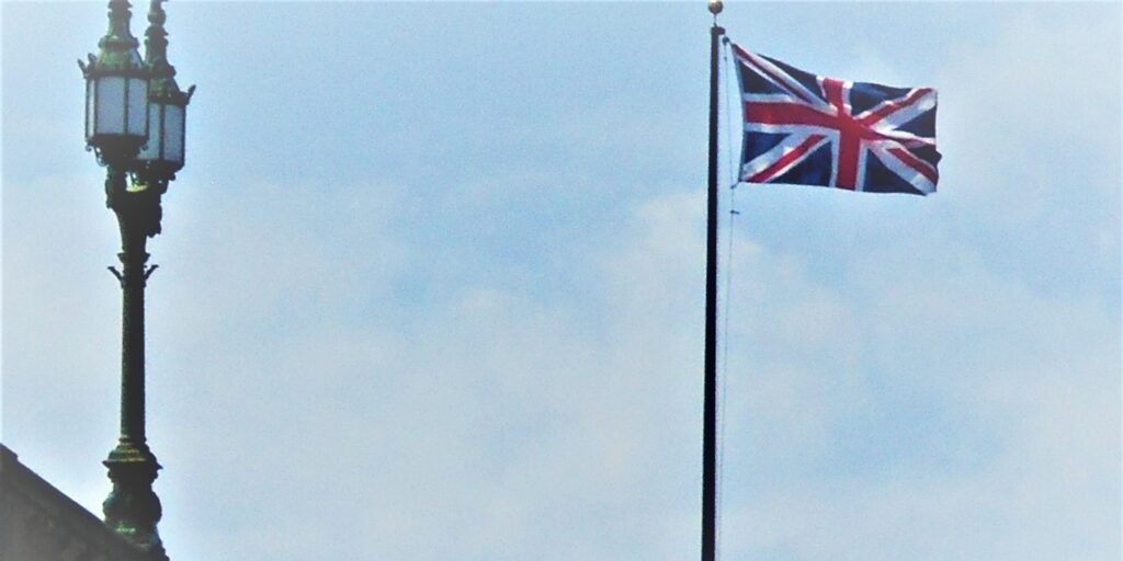 London Locals! An old street light lamp post and the British flag flying!