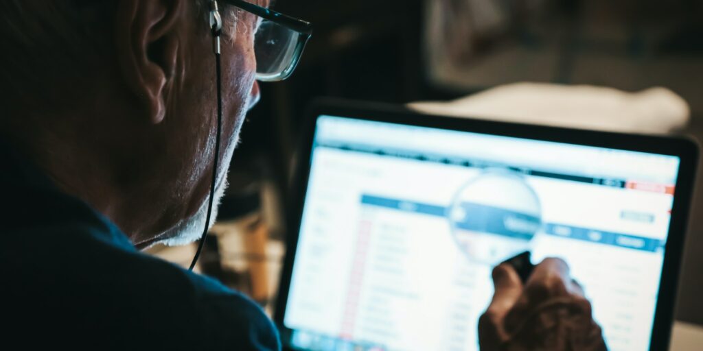 Man watching the stock market at the laptop