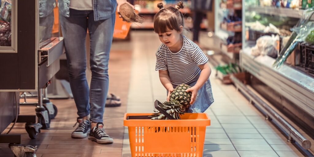 Mom and daughter are shopping at the supermarket