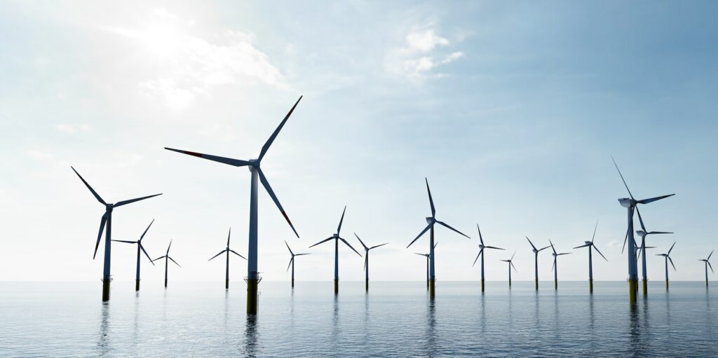 Offshore wind turbines farm on the ocean. Sustainable energy