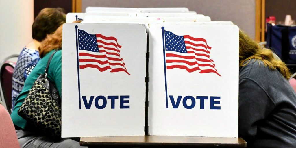 People casting ballots in an election for their favorite politicians candidates. VOTE dividers