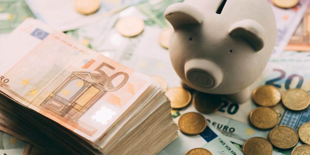Piggy moneybox with euro cash