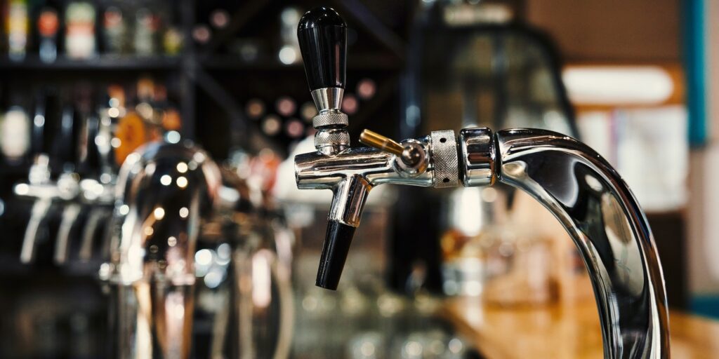 Selective focus of modern beer taps in pub