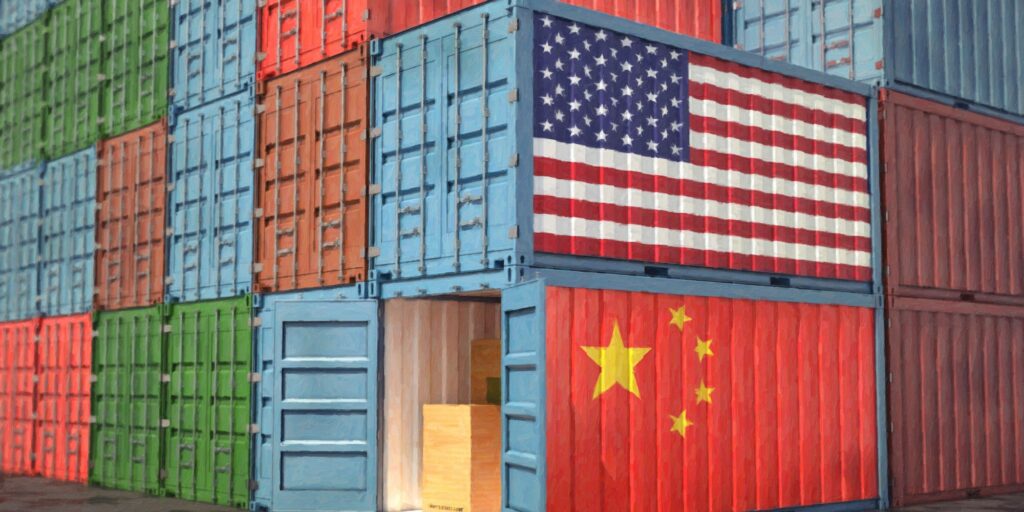 Stacks of Freight containers. USA and China flag