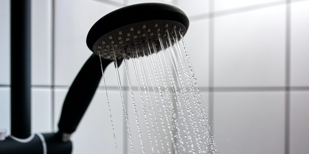 Water from the shower in the modern bathroom