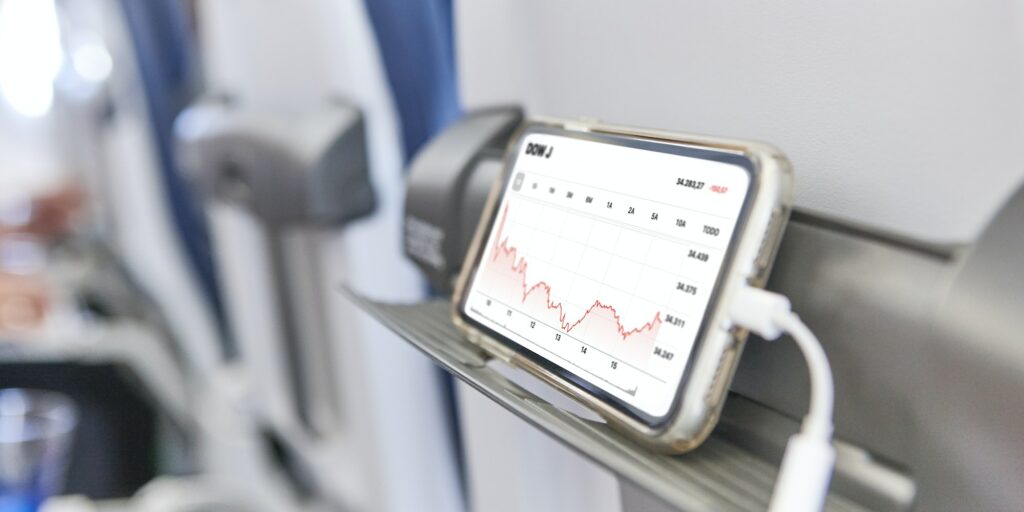 Airplane cabin interior with mobile phone charging batteries. Business
