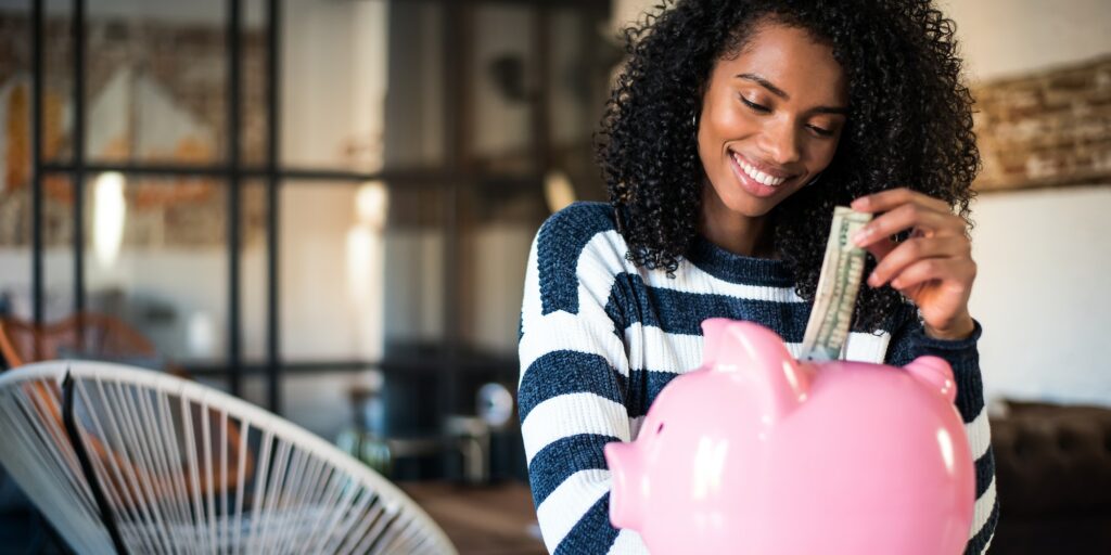 Woman with saving piggy bank