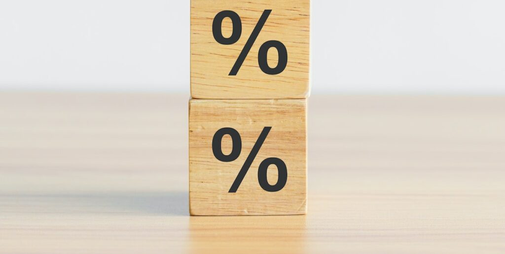 wood block with percentage symbol icon. Interest rate