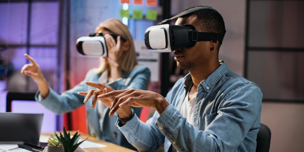 Company workers wearing VR headset during meeting