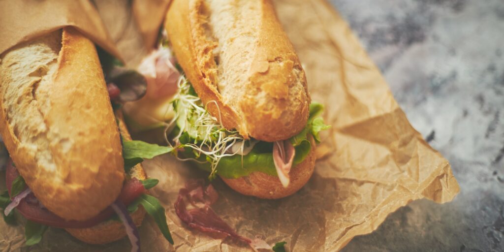 Tasty homemade sandwiches Baguettes with various healthy ingredients. Breakfast take away concept