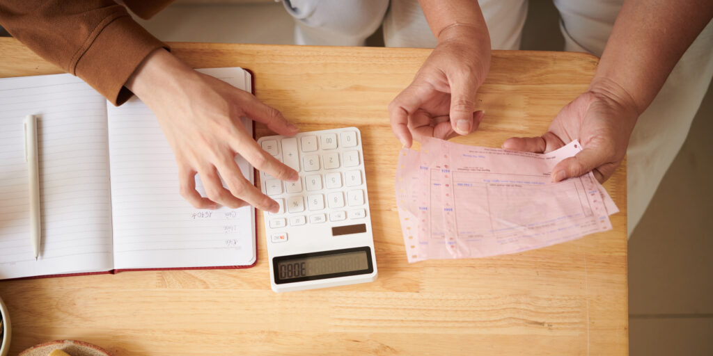 Boy Helping Grandmother to Control Finances