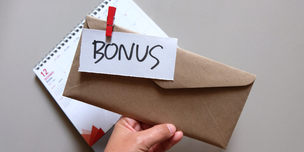 concept of bonus, communication by pulling paper of bonus from the envelope.