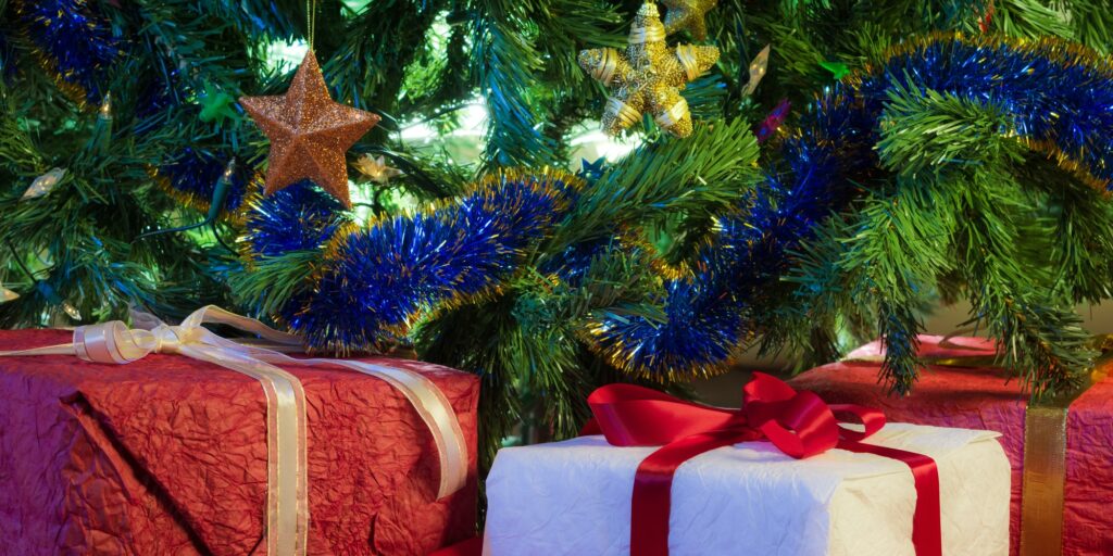 Red gifts with green christmas tree