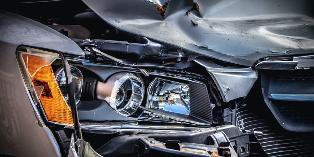 Closeup shot of a crashed cars front