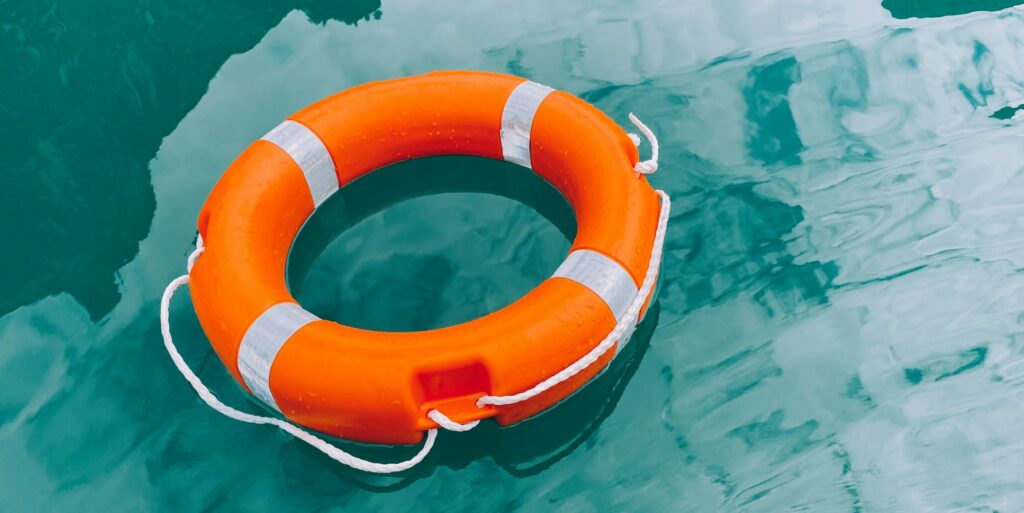 Lifebuoy on turquoise water