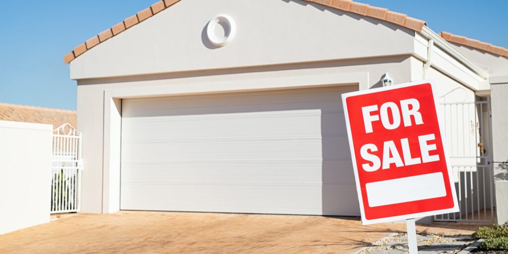 Real estate house with for sale sign