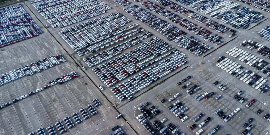 Aerial view car waiting for export shipping to worldwide.