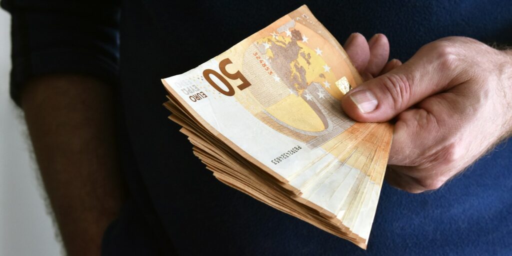 Money in hand.