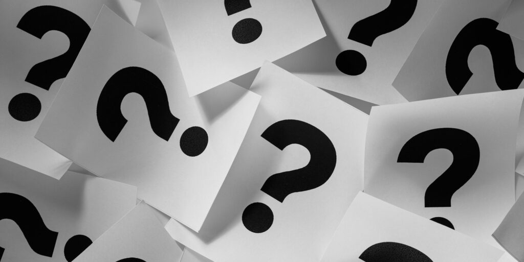 Background texture of printed question marks