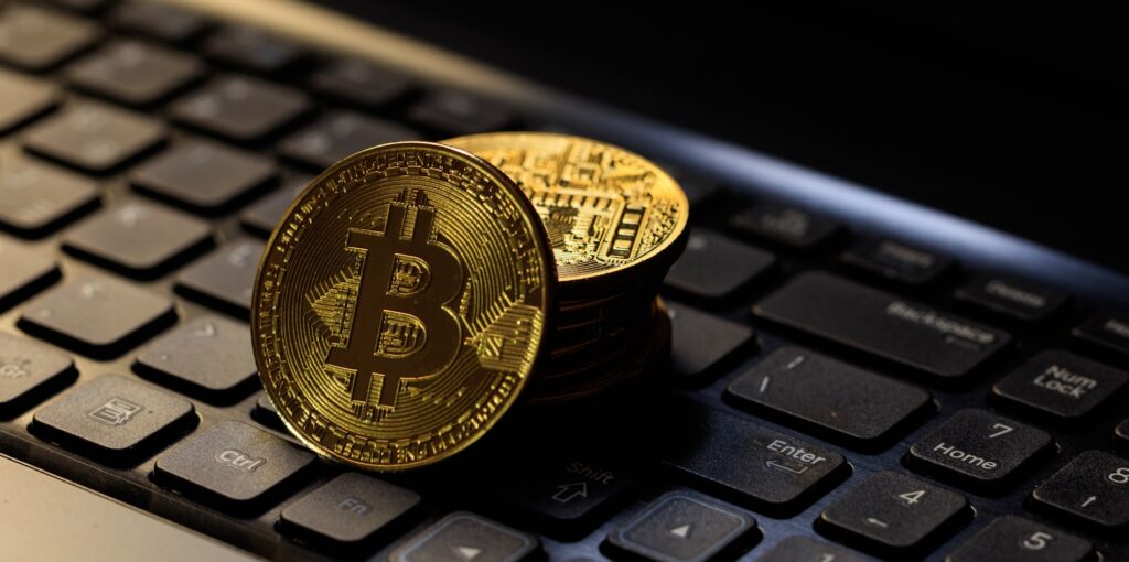Bitcoins on a black laptop