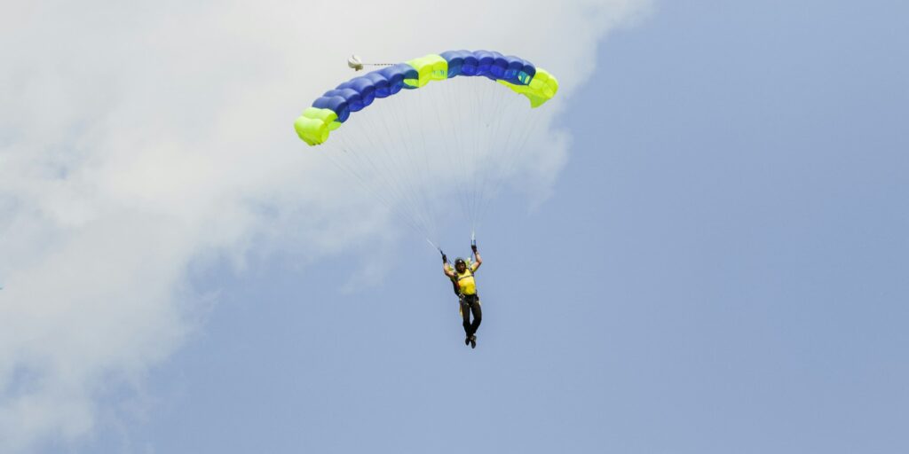 skydiver in the sky with a wing-type parachute