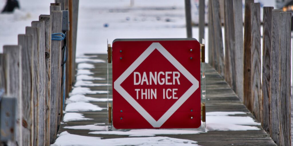 Warning sign. Danger thin ice.