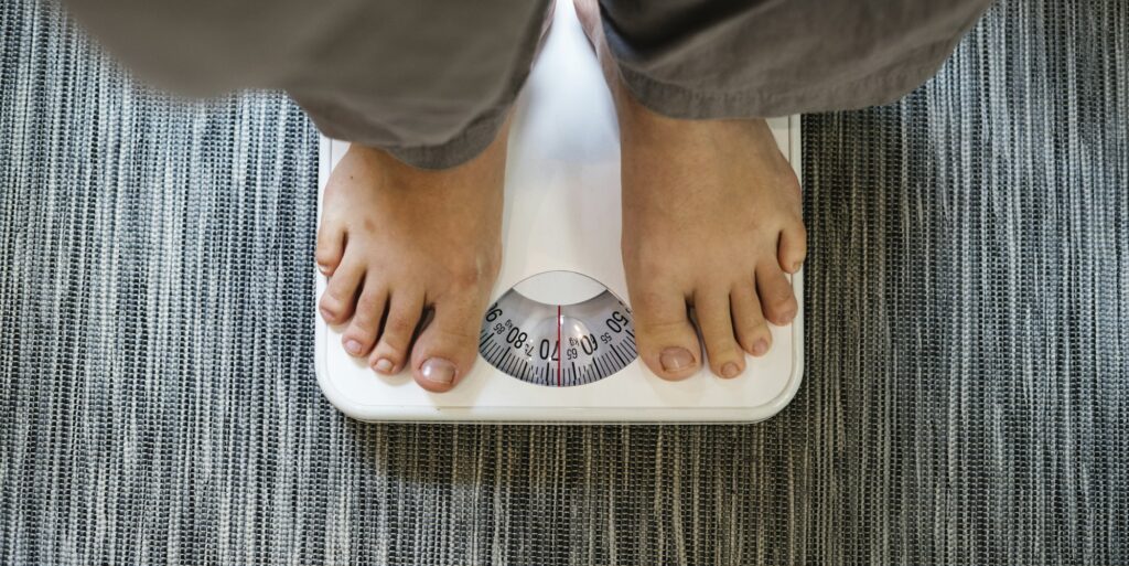 Woman standing on a scale