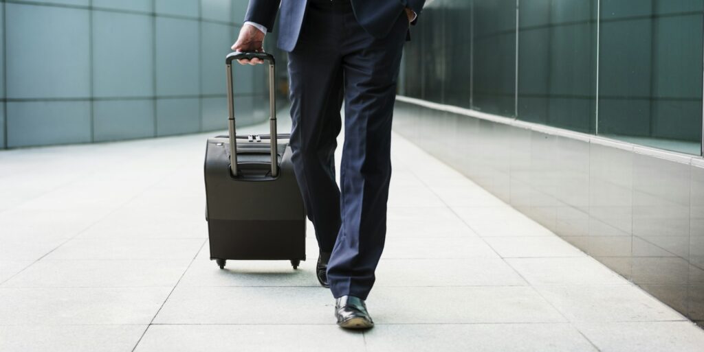 Businessman walking with his luggage