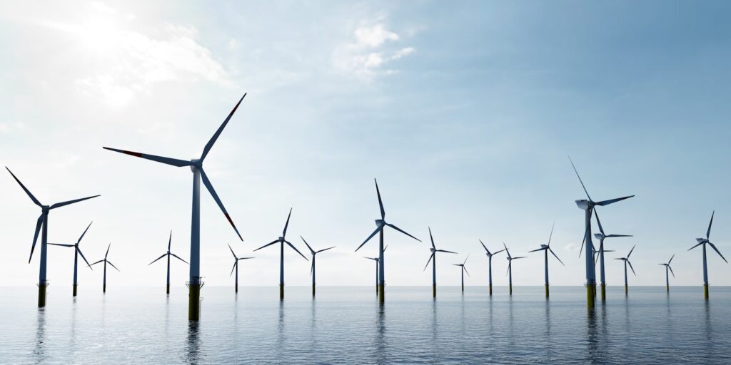 Offshore wind turbines farm on the ocean. Sustainable energy
