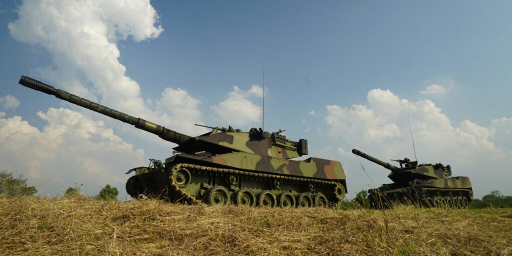 military soldier with rifle in armored tank.