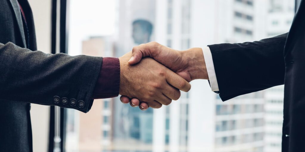 Business people shaking hands.
