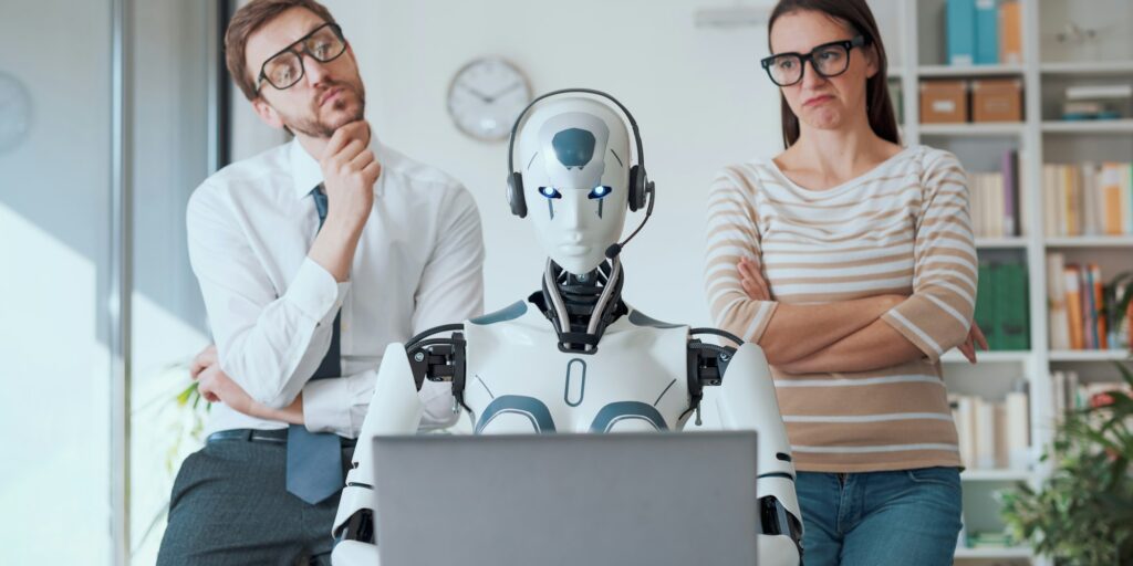 Business people supervising a robot work