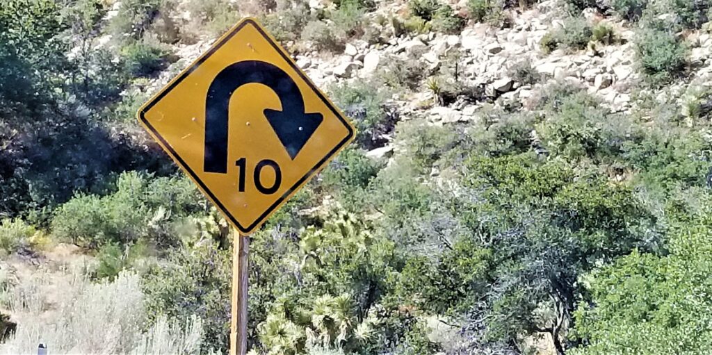 Street Signs! Caution! Curved road ahead!