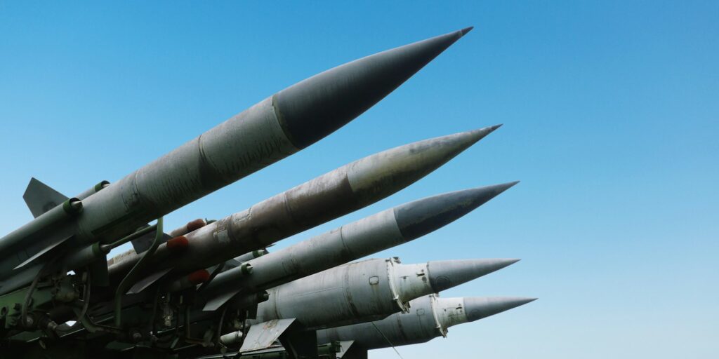 Missiles weapons rockets on a blue sky, concept. War in Israel and Palestine