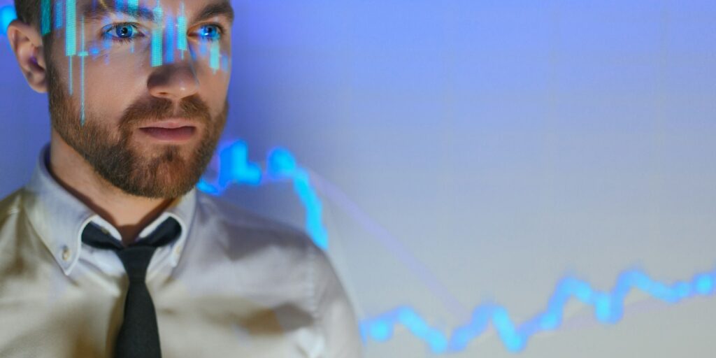 Stock Market Trader Working Investment Charts, Graphs, Ticker, Diagrams Projected
