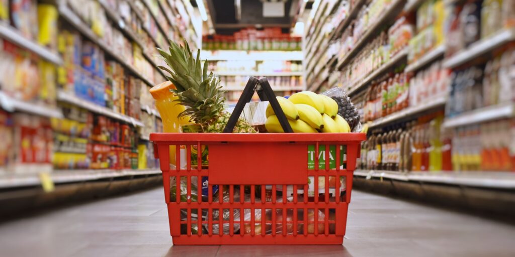 Basket with groceries in the supermarket