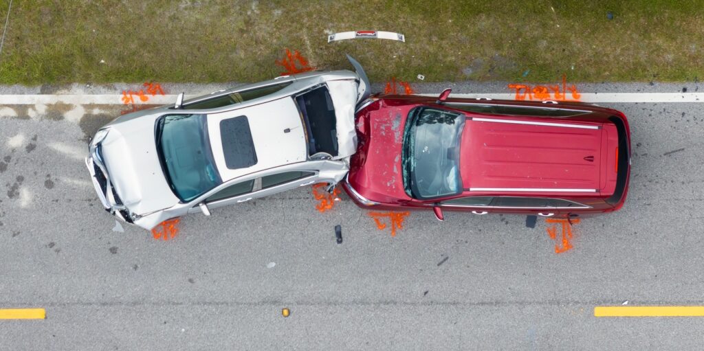 Car crash with two vehicles collided at traffic accident site on American street