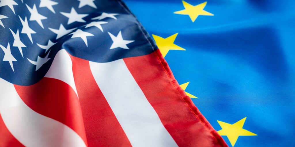 Eu europe union flag and usa united states of america flag. Two waving flags