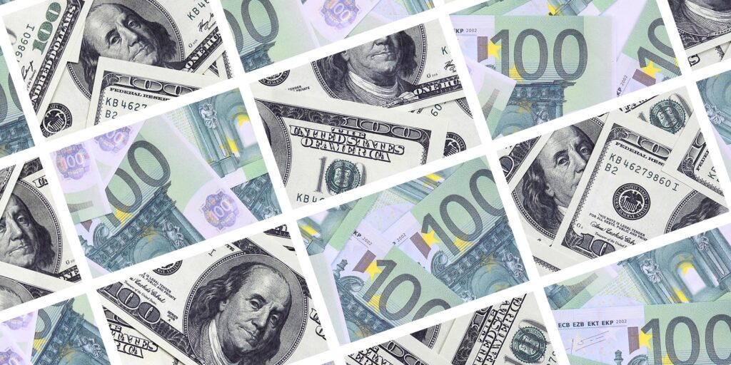 A collage of many images of euro banknotes in denominations of 100 and 500 euros lying in the heap