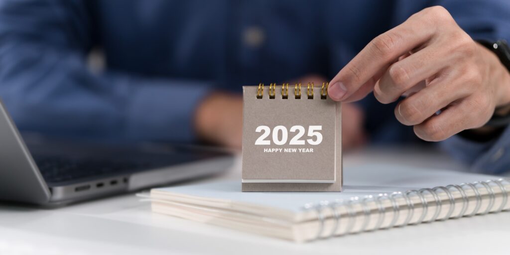 Man hand holding 2025 calendar. 2025 Happy New year.