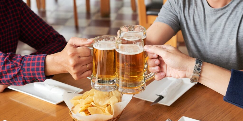 Clinking beer mugs