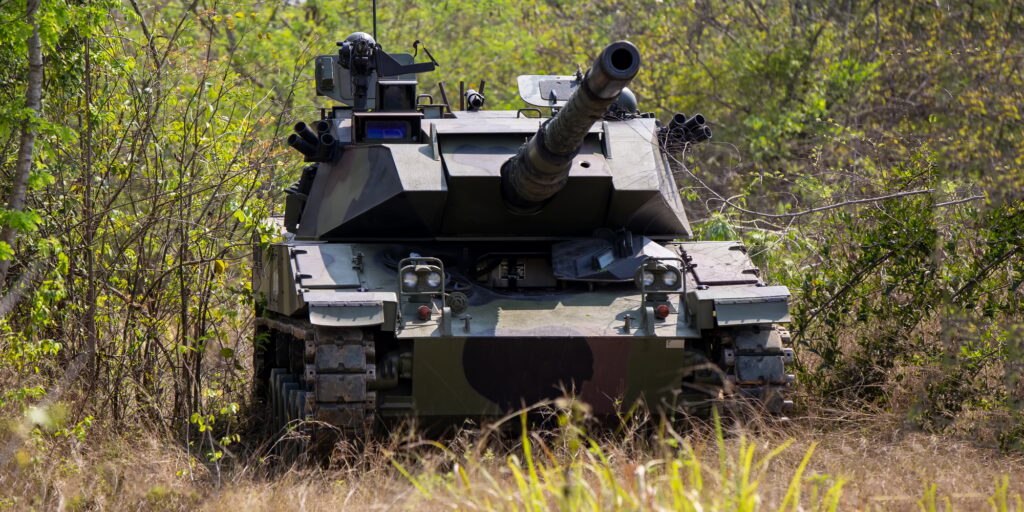 Armored tank on the battle field forest.