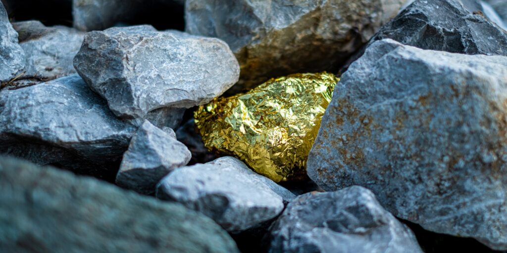 Gold nugget and grey granite stone