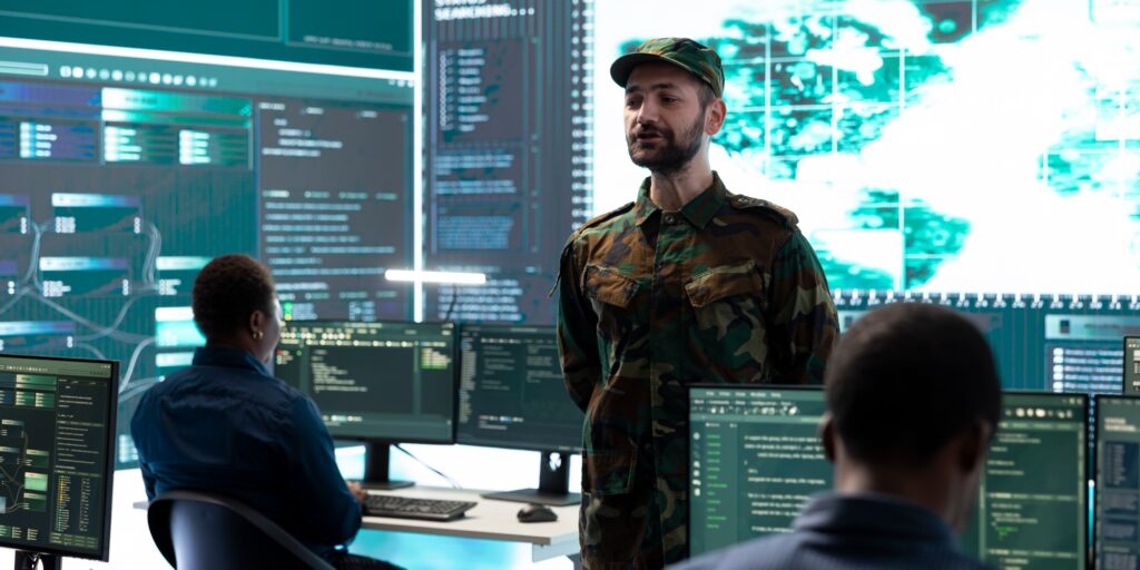 Military personnel working in a government cyber defense center