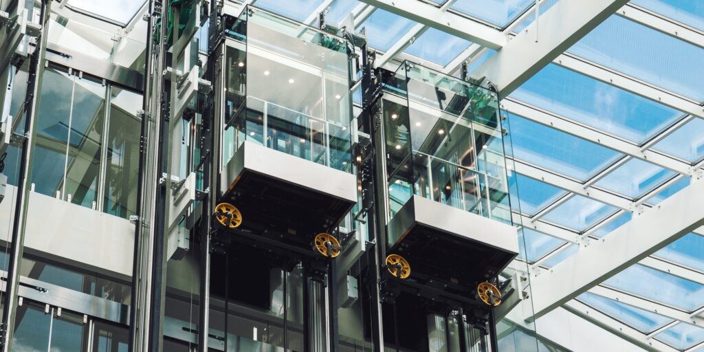 Modern elevator glass cabins in a contemporary business center