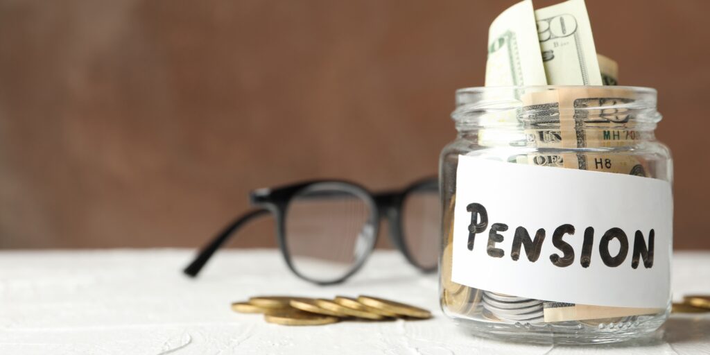 Jar with money and inscription Pension against brown background, space for text