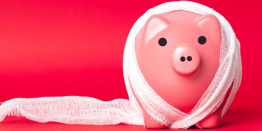 piggy bank with a white bandage