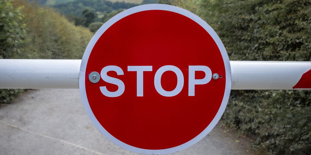 Red Stop sign blocking the road